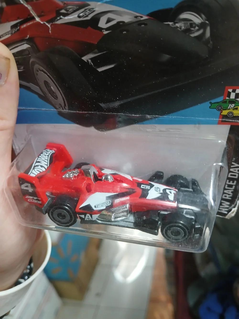 1:64 scale red and black HW-4-TRAC die-cast car from the 2024 Hot Wheels HW Race